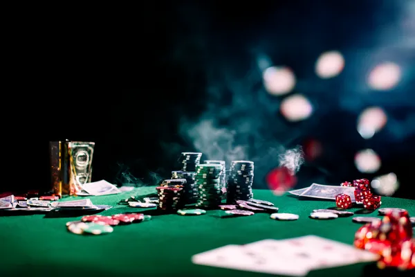 A close-up shot of golden coins falling around a spinning roulette wheel, representing immersive casino action at LUCKYBANGLA88.