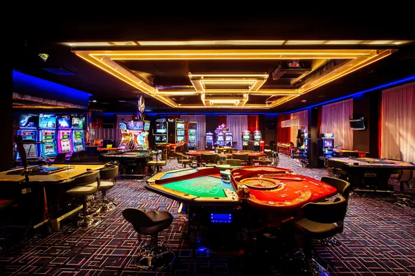 LUCKYBANGLA88 Mobile Casino — Play anytime, anywhere A player using their smartphone during a festive local event, representing LUCKYBANGLA88’s fully mobile-friendly casino.